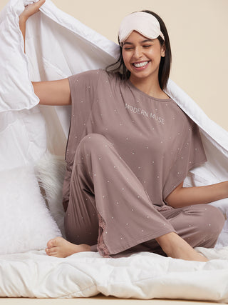 a women wearing black muse pyjama set made of modal spandex